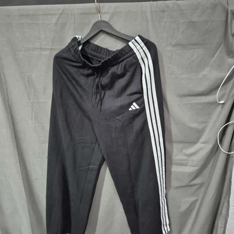 ADIDAS BLACK TRACK PANTS WITH WHITE SIDE STRIPES – UK 12-14 (WOMEN)