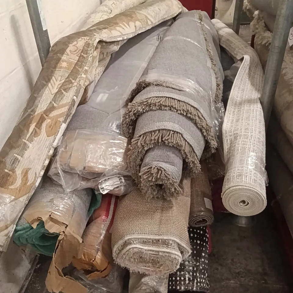 STILLAGE CONTAINING DESIGNER AREA RUGS APPROXIMATELY 15 RUGS 