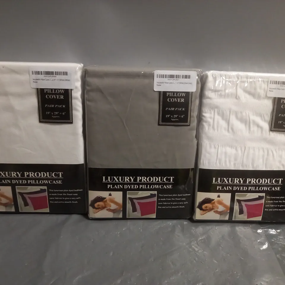 APPROXIMATELY 20 ASSORTED PLAIN DYED PILLOWCASES IN VARIOUS COLOURS