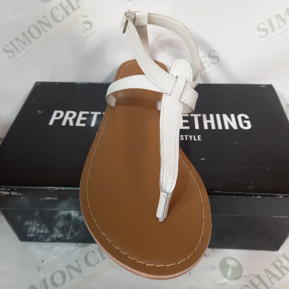 BOXED PAIR OF PRETTY LITTLE THING FLAT SANDALS IN WHITE EU SIZE 41