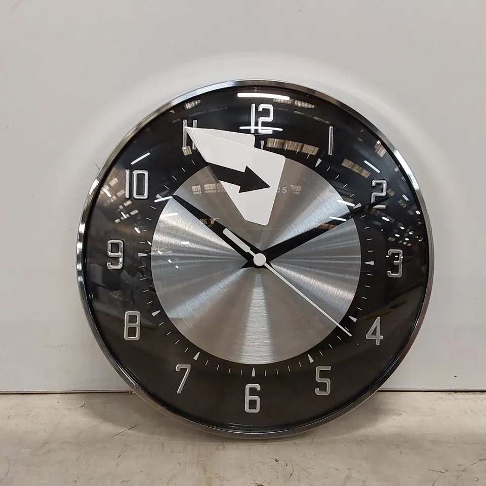 BOXED ROGER LASCELLES METAL WALL CLOCK (1 BOX)