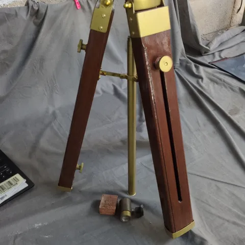 THREE-LEGGED WOODEN TRIPOD WITH BRASS FITTINGS AND CENTRAL POST