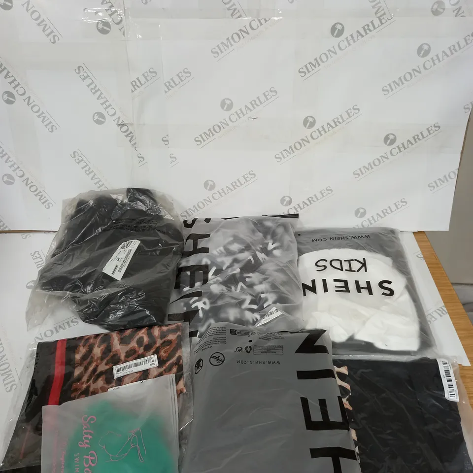 LARGE BOX OF ASSORTED CLOTHING ITEMS IN VARIOUS COLOURS AND SIZES INCLUDING TROUSERS , TOPS AND JUMPERS 