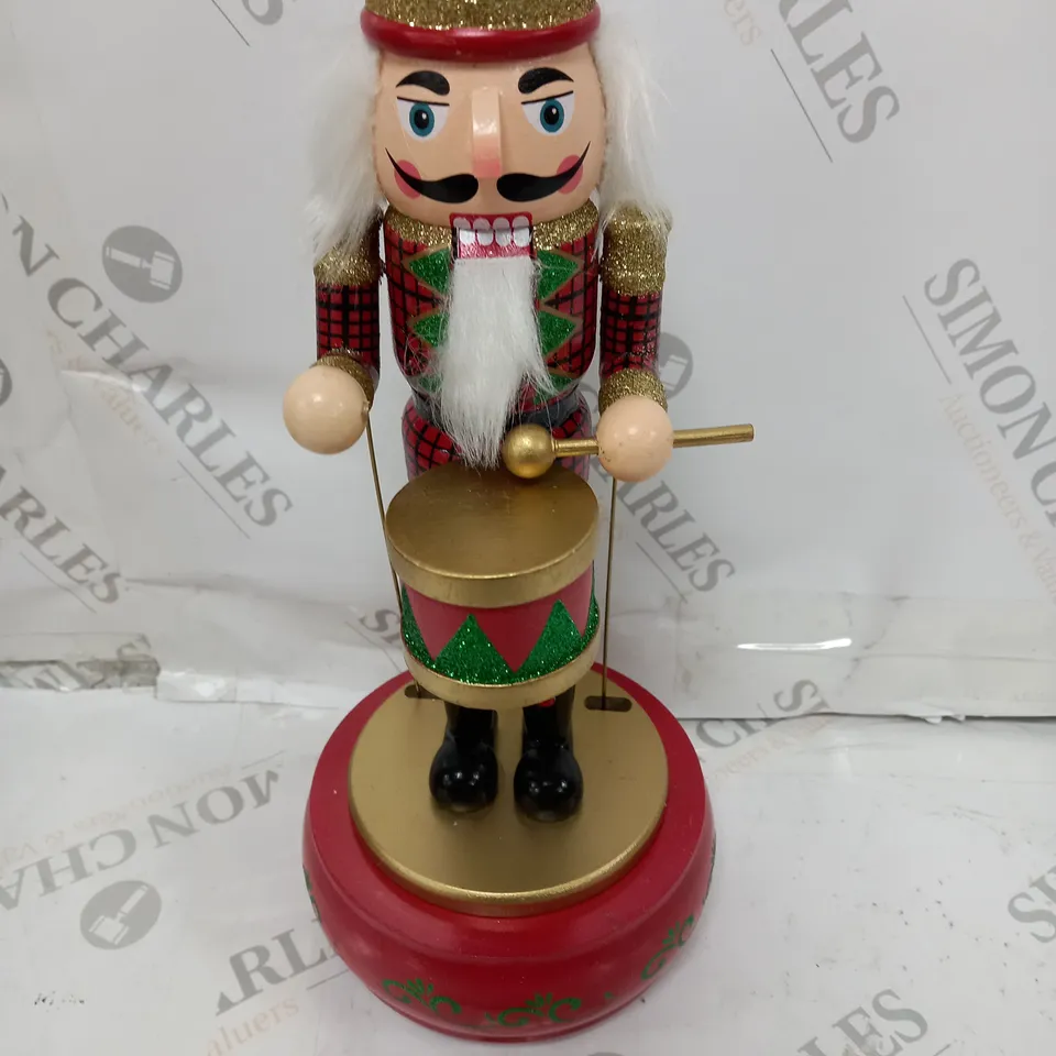 FESTIVE 32CM WOODEN ANIMATED MUSICAL NUTCRACKER