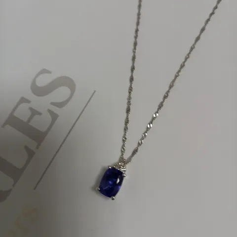 DESIGNER 18CT WHITE GOLD PENDANT ON A CHAIN, SET WITH AN OVAL CUT TANZANITE AND DIAMONDS WEIGHING +-1.44CT