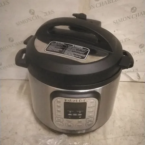 BOXED INSTANT POT MULTI USE PRESSURE COOKER