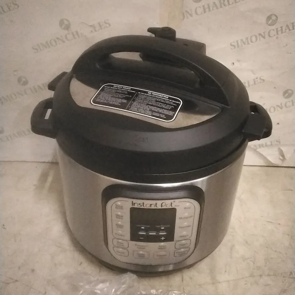 BOXED INSTANT POT  MULTI USE PRESSURE COOKER 