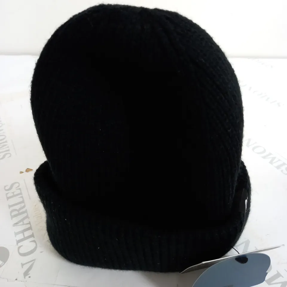 OUTSIDE IN BEANIE HAT IN BLACK