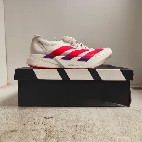 BOXED PAIR OF ADIDAS ADIZERO ADIOS PRO 4 TRAINERS IN WHITE/RED/PURPLE SIZE UK 12