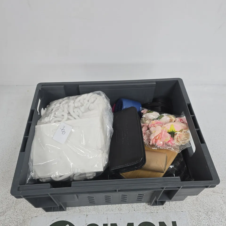 TOTE OF APPROXIMATELY 8 ASSORTED ITEMS INCLUDING PAPER BAGS, BAKING PAPER AND FAKE ROSES