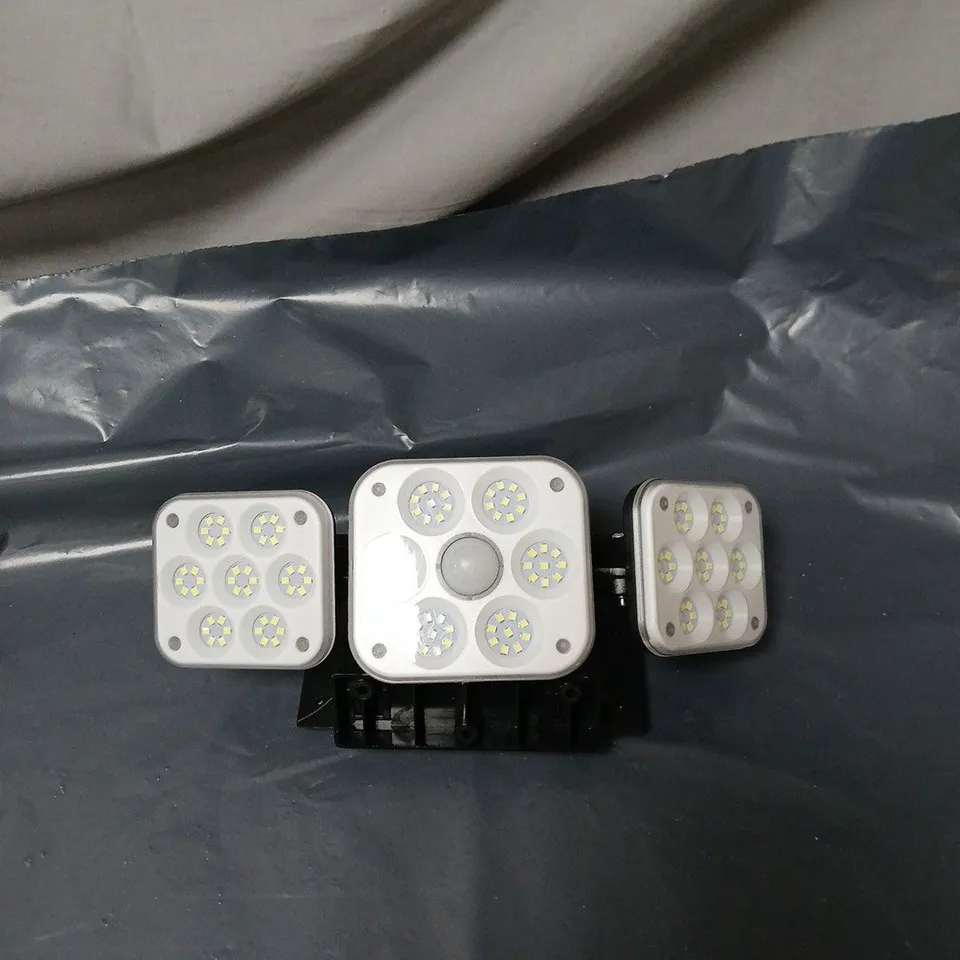 SOLAR-POWERED MOTION SENSOR WALL LIGHT. UNBOXED, NO ACCESSORIES.