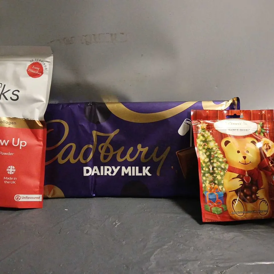 TOTE OF APPROX 7 ASSORTED FOOD ITEMS TO INCLUDE - CADBURYS DAIRY MILK , COLLGEN GLOW UP , LINDT CRISP BITES ETC