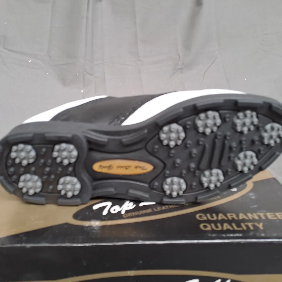 BOX OF APPROXIMATLY 12 BLACK AND WHITE TOP LINE GOLF SHOES IN VARIOUS SIZE 