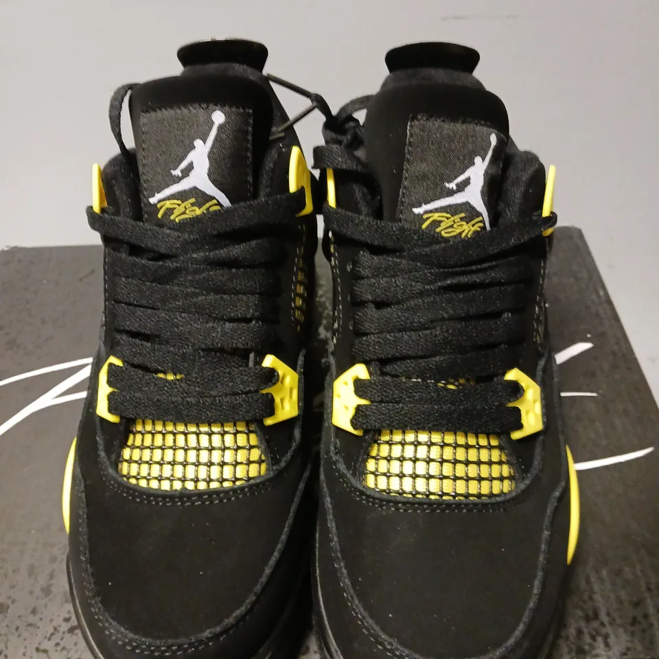 BOXED PAIR OF NIKE AIR JORDAN 4 RETRO THUNDER TRAINERS, BLACK/YELLOW - UK SIZE 5.5