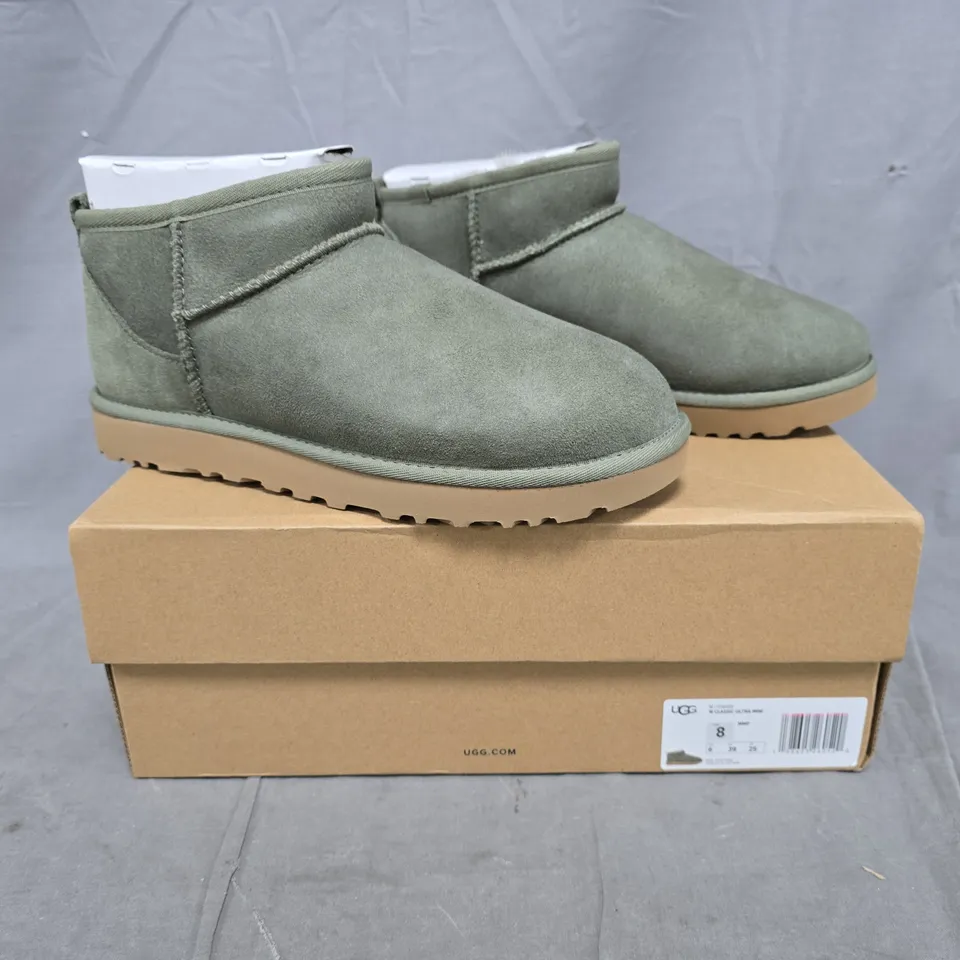 BOXED PAIR OF UGG CLASSIC ULTRA MINI SHOES IN GREEN SIZE UK 6