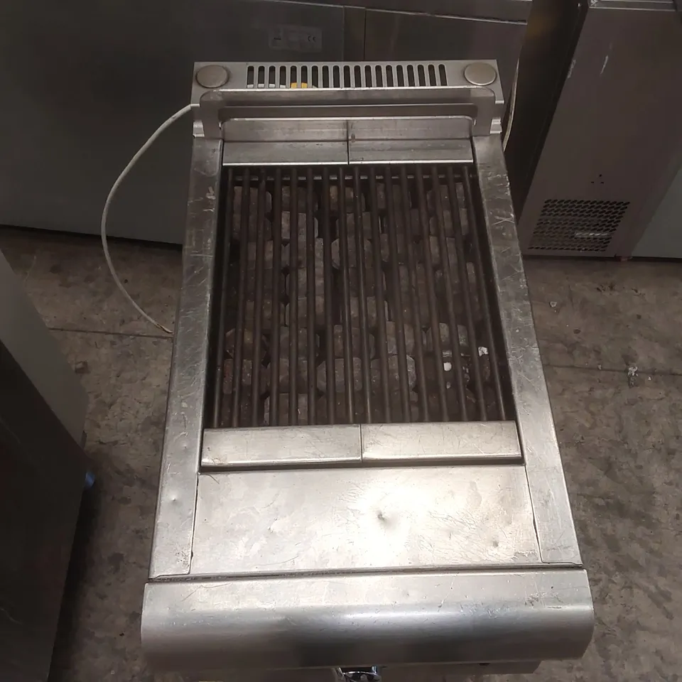 BONNET GAS LAVA ROCK GRILL ON CUPBOARD UNIT
