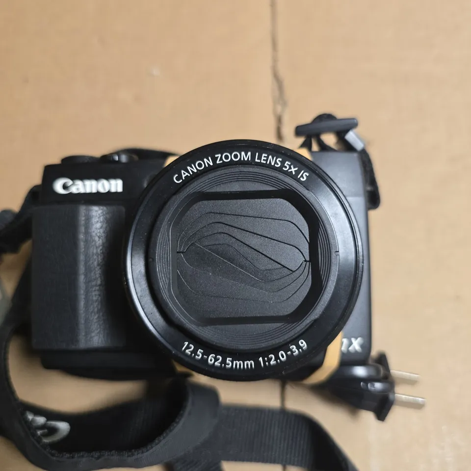 CANON DIGITAL CAMERA WITH 5X ZOOM LENS (12.5-62.5MM) – WITH STRAP AND BATTERY CHARGER 