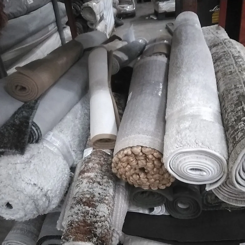 STILLAGE OF APPROXIMATELY 24 DESIGNER RUGS