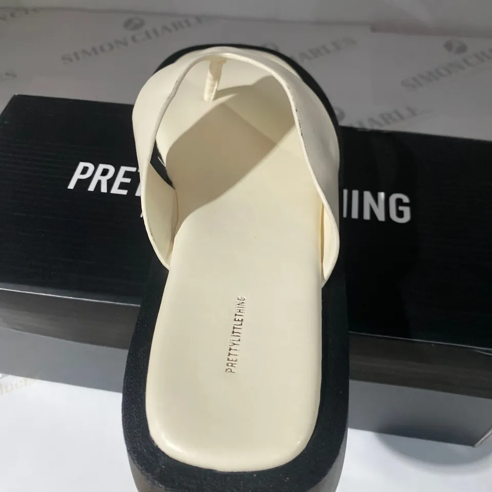 BOXED PAIR OF PRETTYLITTLETHING SLIP ONS SIZE 6