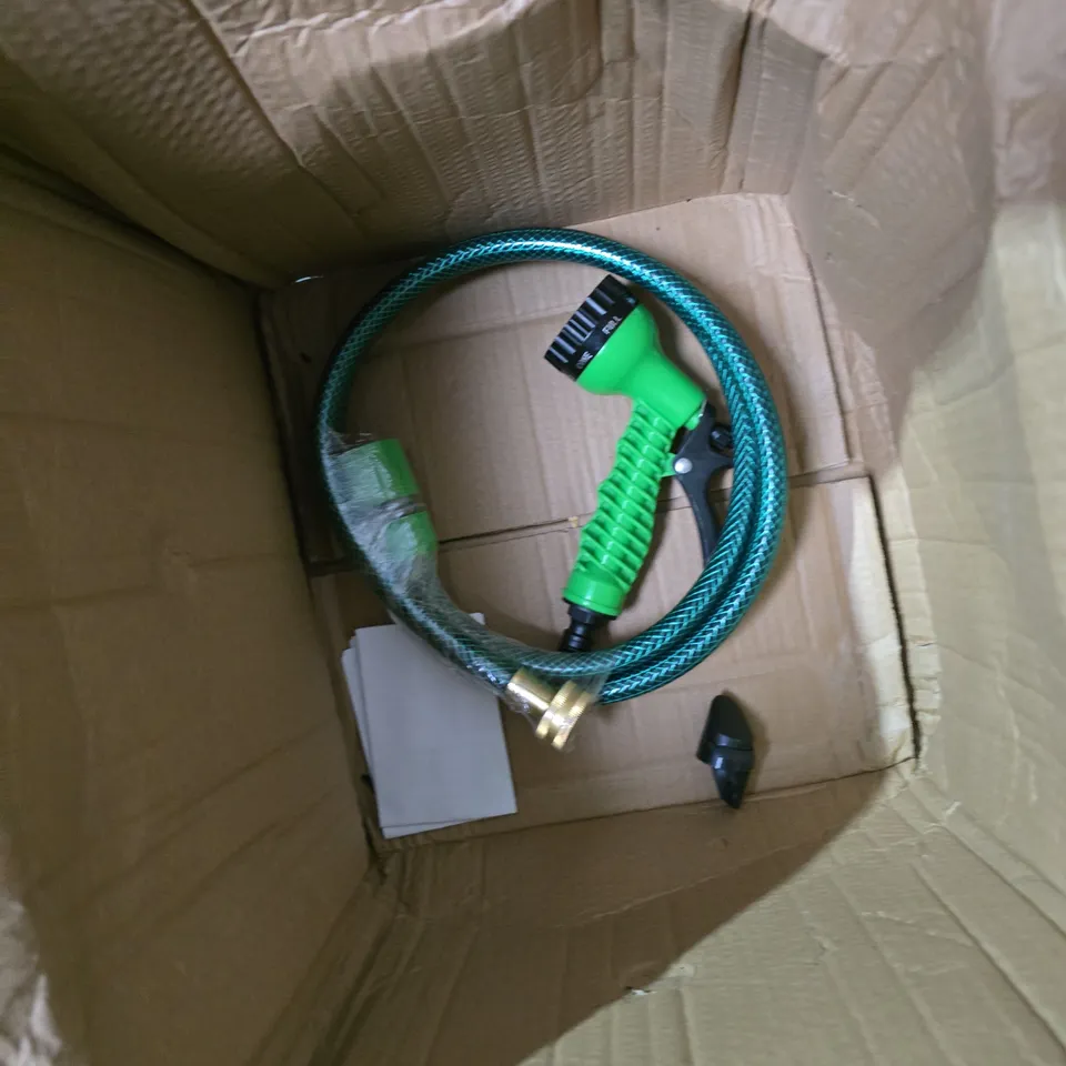 GARDEN HOSE REEL WITH GREEN HOSE, ORANGE DRUM AND SPRAY NOZZLE