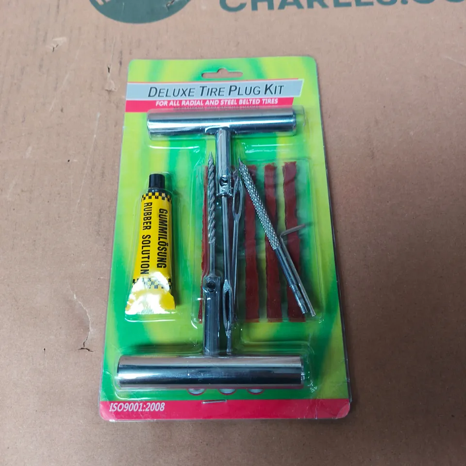 TOTE OF APPROXIMATELY 10 ASSORTED AUTO PARTS TO INCLUDE: DELUXE TIRE PLUG KIT 