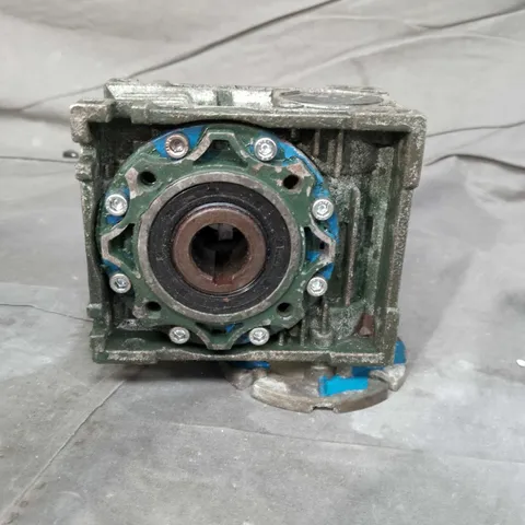 Industrial gearbox housing with circular mounting flange – green metal 