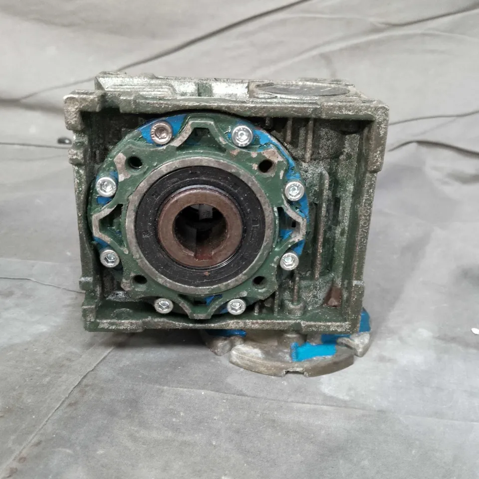 Industrial gearbox housing with circular mounting flange – green metal