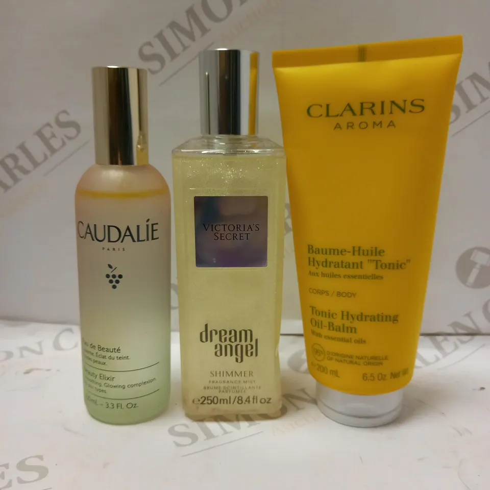 LOT OF 3 ASSORTED BEAUTY PRODUCTS TO INCLUDE CLARINS TONIC MOISTURISING BALM, CAUDALIE EAU DE BEAUTÉ COMPLEXION, VICTORIA'S SECRET DREAM ANGEL SHIMMER MIST