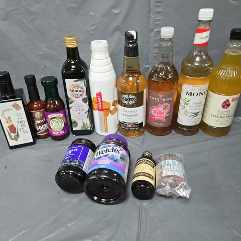 APPROXIMATELY 10 ASSORTED FOOD ITEMS TO INCLUDE EXTRA VIRGIN OLIVE OIL, COFFEE SYRUP, AND BLUEBERRY JAM ETC.