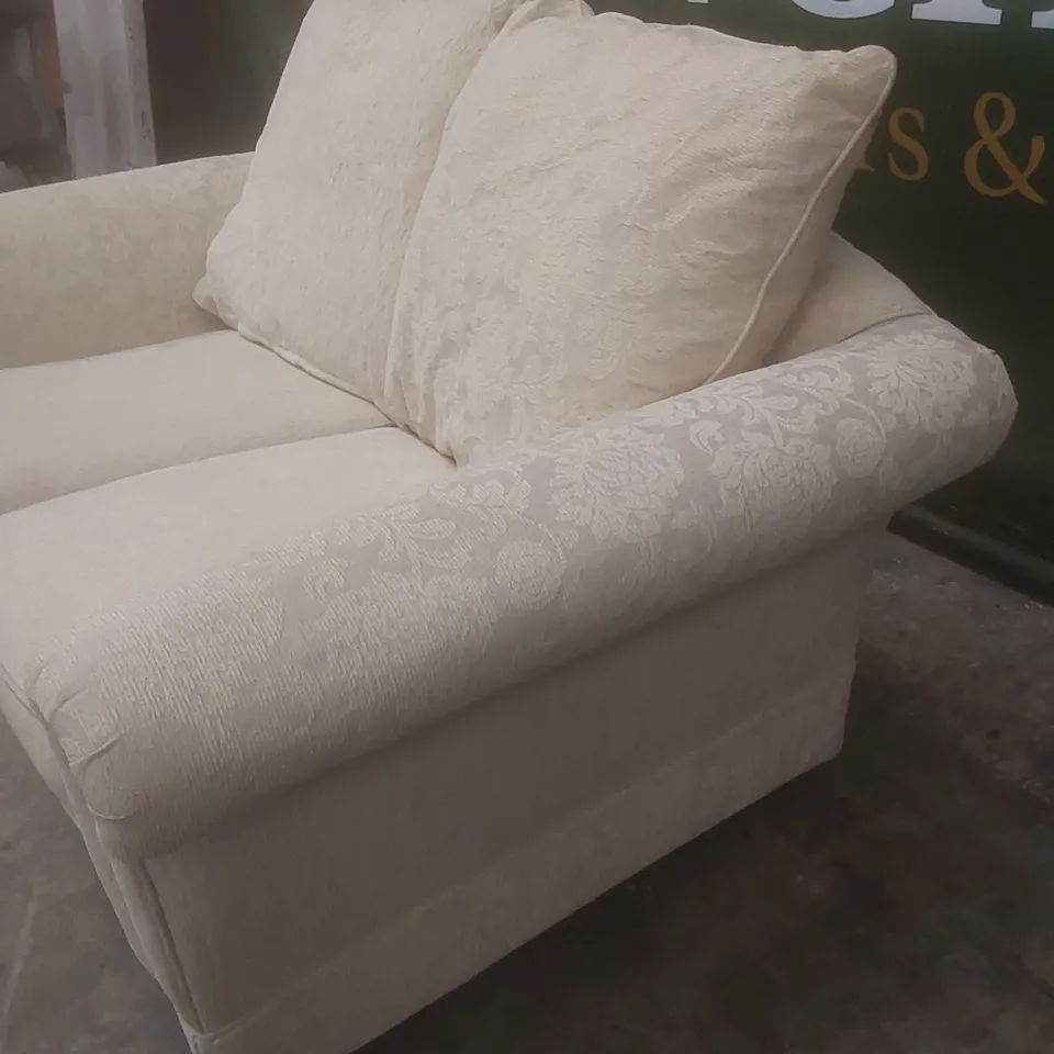 DESIGNER 2 SEATER FLORAL FABRIC UPHOLSTERED SOFA ON CASTORS