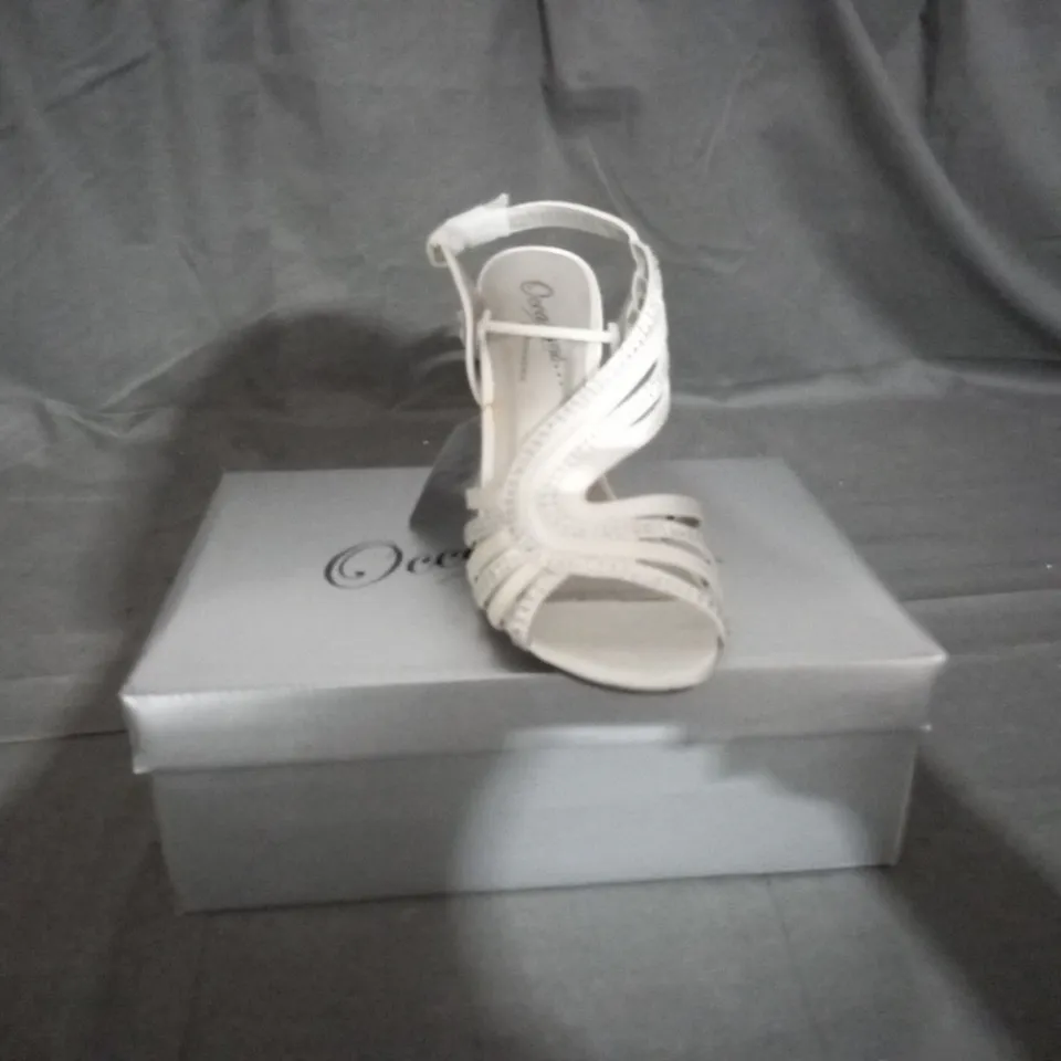 APPROXIMATELY 12 BOXED PAIR OF CASANDRA IVORY HEELED SANDALS IN VARIOUS SIZES TO INCLUDE SIZE 5