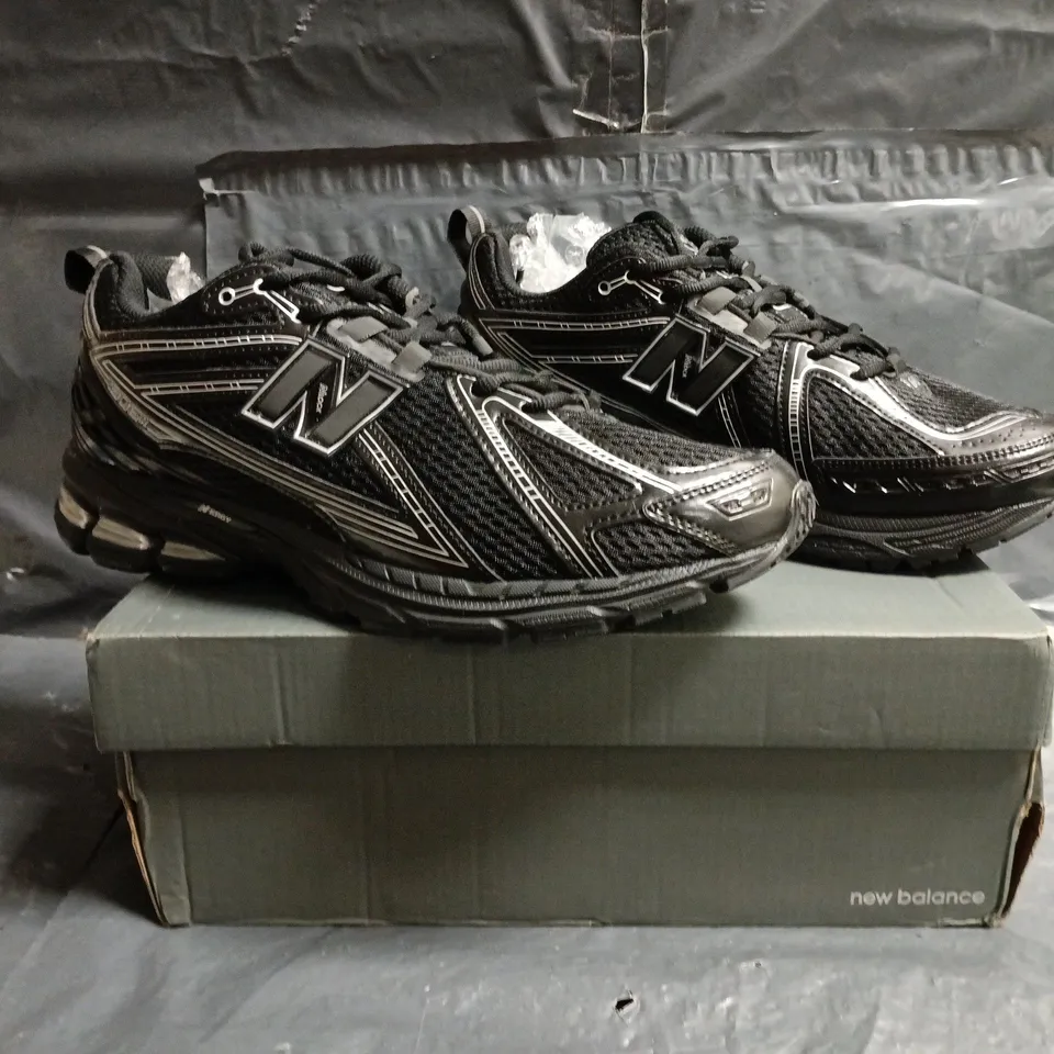 BOXED PAIR OF NEW BALANCE 1906R TRAINERS IN BLACK SIZE UK 10