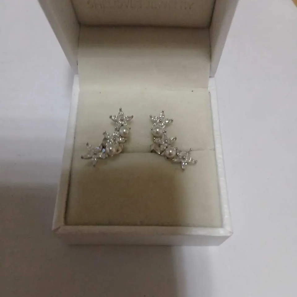 DIAMONIQUE STAR EARRINGS