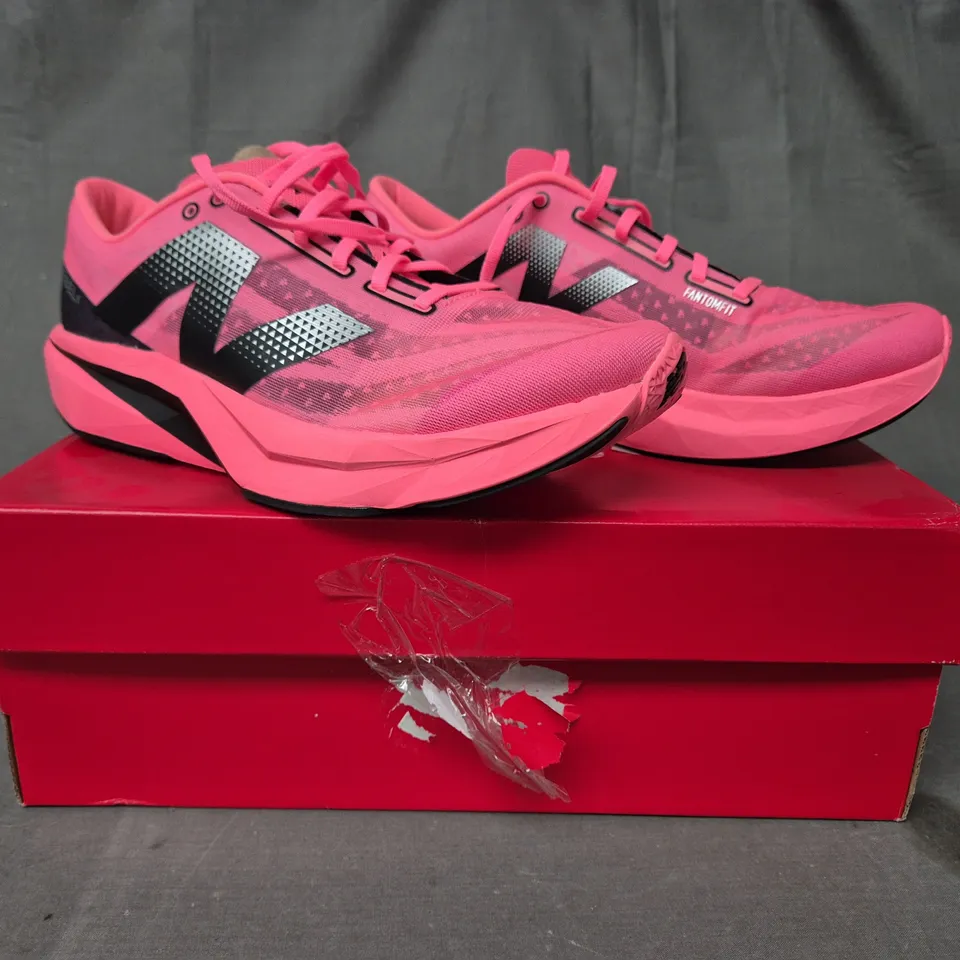 BOXED PAIR OF NEW BALANCE FUELCELL REBEL V4 TRAINERS IN PINK/BLACK UK SIZE 11.5