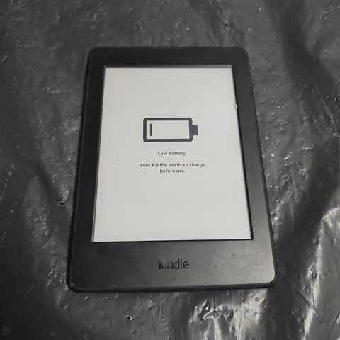 AMAZON KINDLE E-READER – BLACK, WITH LOW BATTERY MESSAGE