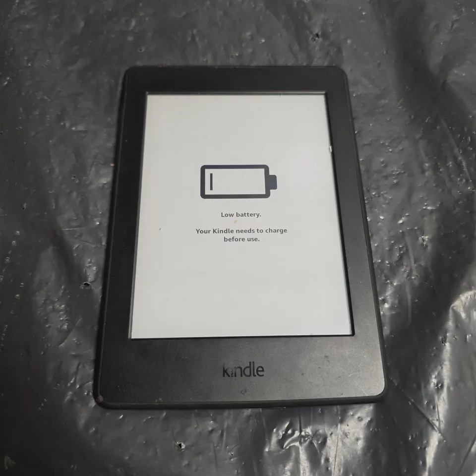 AMAZON KINDLE E-READER – BLACK, WITH LOW BATTERY MESSAGE