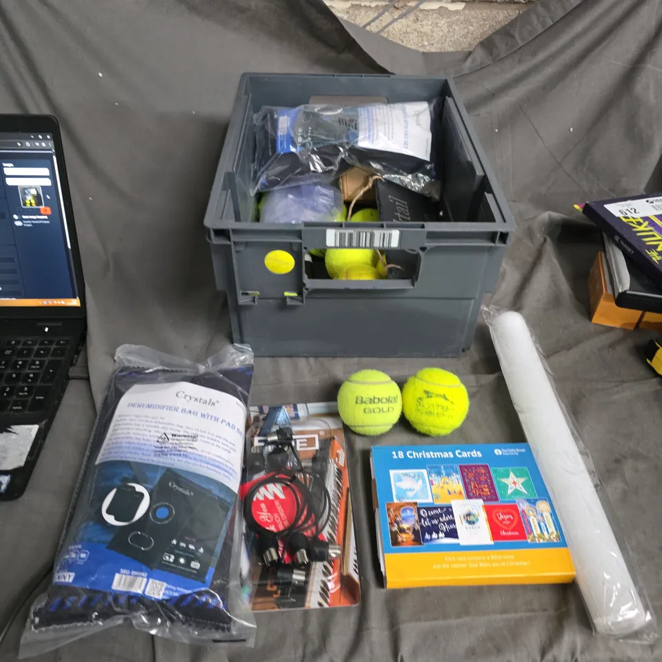 APPROXIMATELY 20 ITEMS INCLUDING TENNIS BALLS CHRISTMAS CARDS ,AND CRYSTALS DEHUMIDIFIER BAG WITH PAD SET PLUS HOUSEHOLD ITEMS .