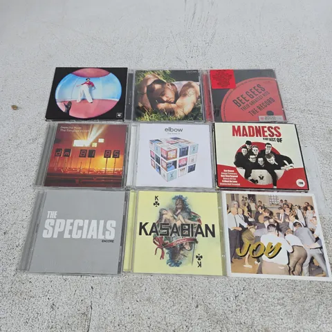APPROXIMATELY 9 ASSORTED CD ALBUMS TO INCLUDE MADNESS, BEE GEES, THE SPECIALS ETC