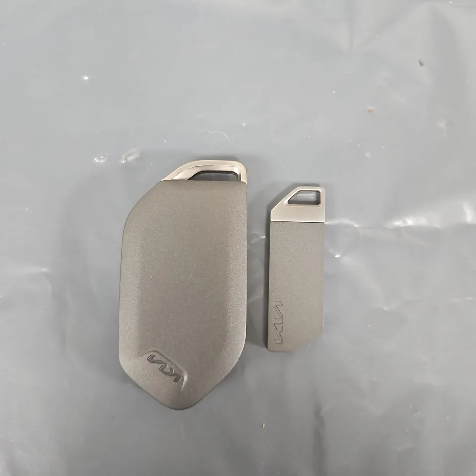KIA CAR KEY FOB WITH THREE-FUNCTION BUTTONS AND METAL KEY TAG (VERIFY MODEL)