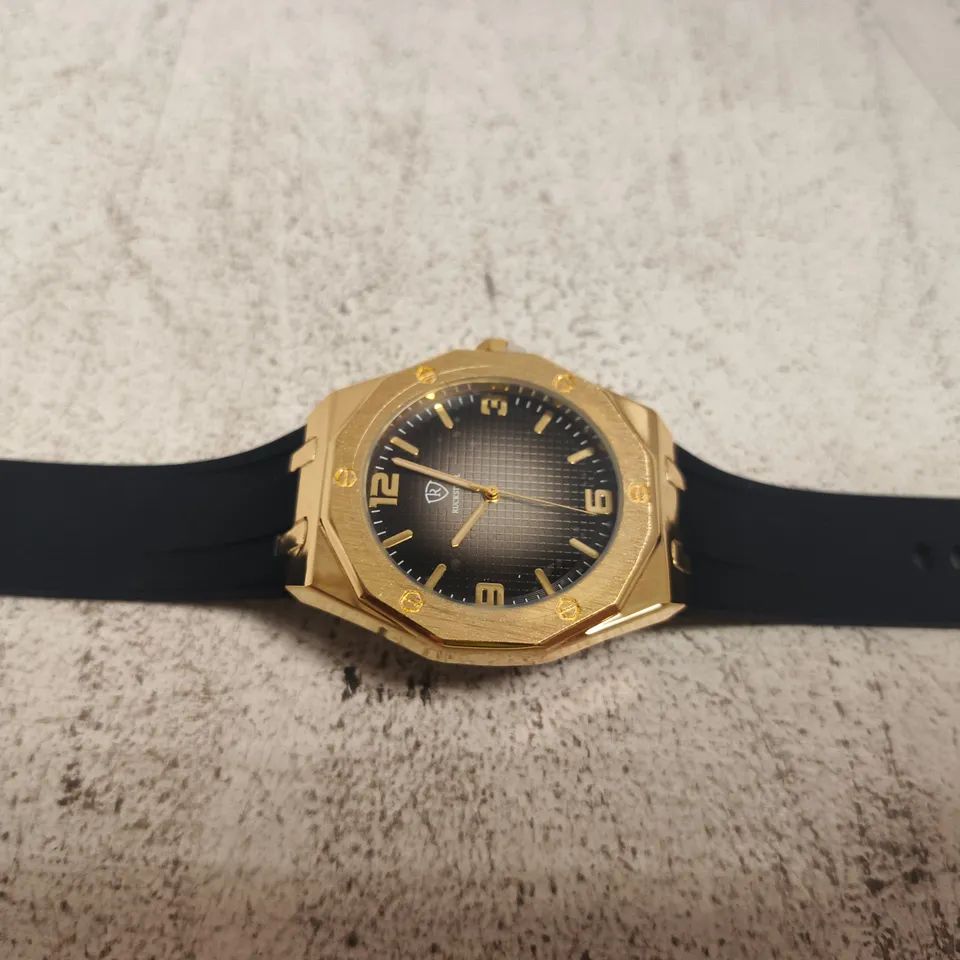 RUCKSTUHL GOLD-TONE WRISTWATCH – BLACK DIAL, RUBBER STRAP