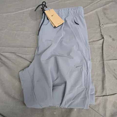 NIKE UNLIMITED DRI-FIT TRAINING TROUSERS – LIGHT GREY, UK LARGE (L)