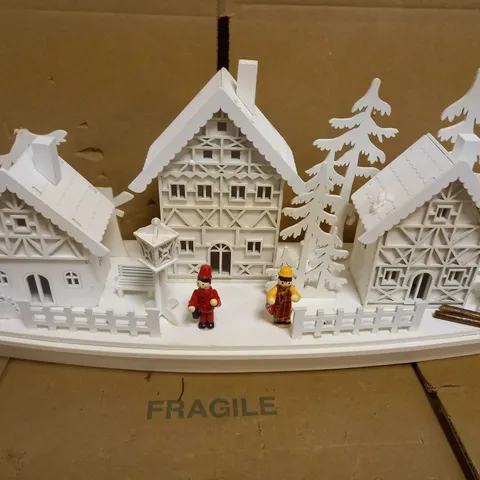 WHITE WOOD LIT VILLAGE SCENE