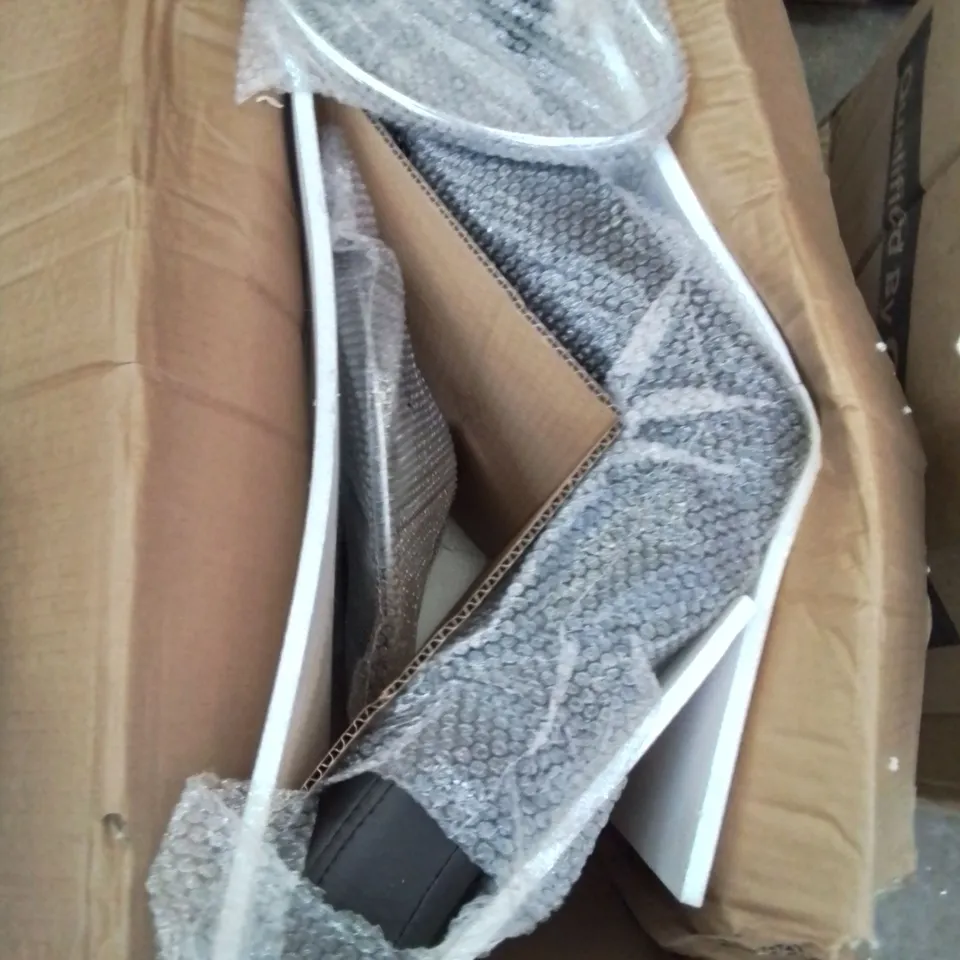 A BOXED BLACK FAUX LEATHER HEIGHT ADJUSTABLE SWIVEL STOOL