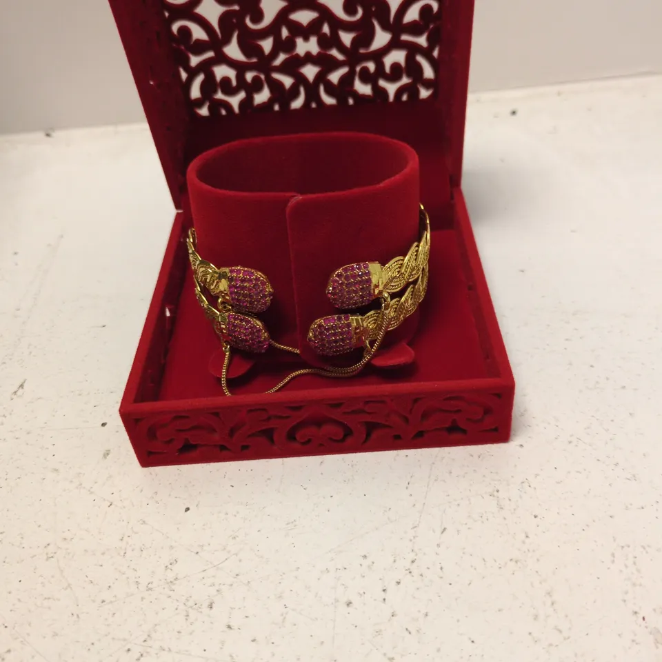 GOLD-TONE BRACELET WITH PINK STONES IN RED VELVET JEWELLERY BOX (BOXED)