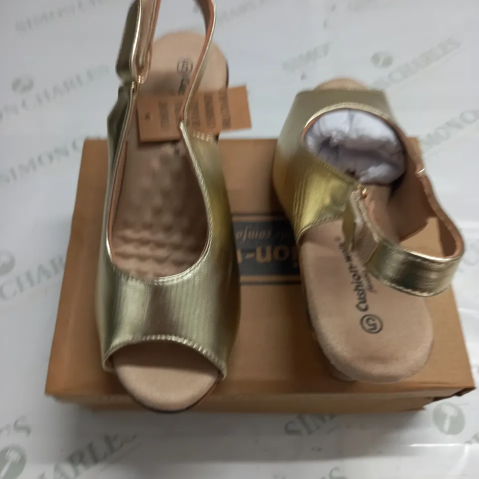 BOXED PAIR OF CUSHION WALK GOLD WEDGE HEEL SHOES IN GOLD - SIZE 5