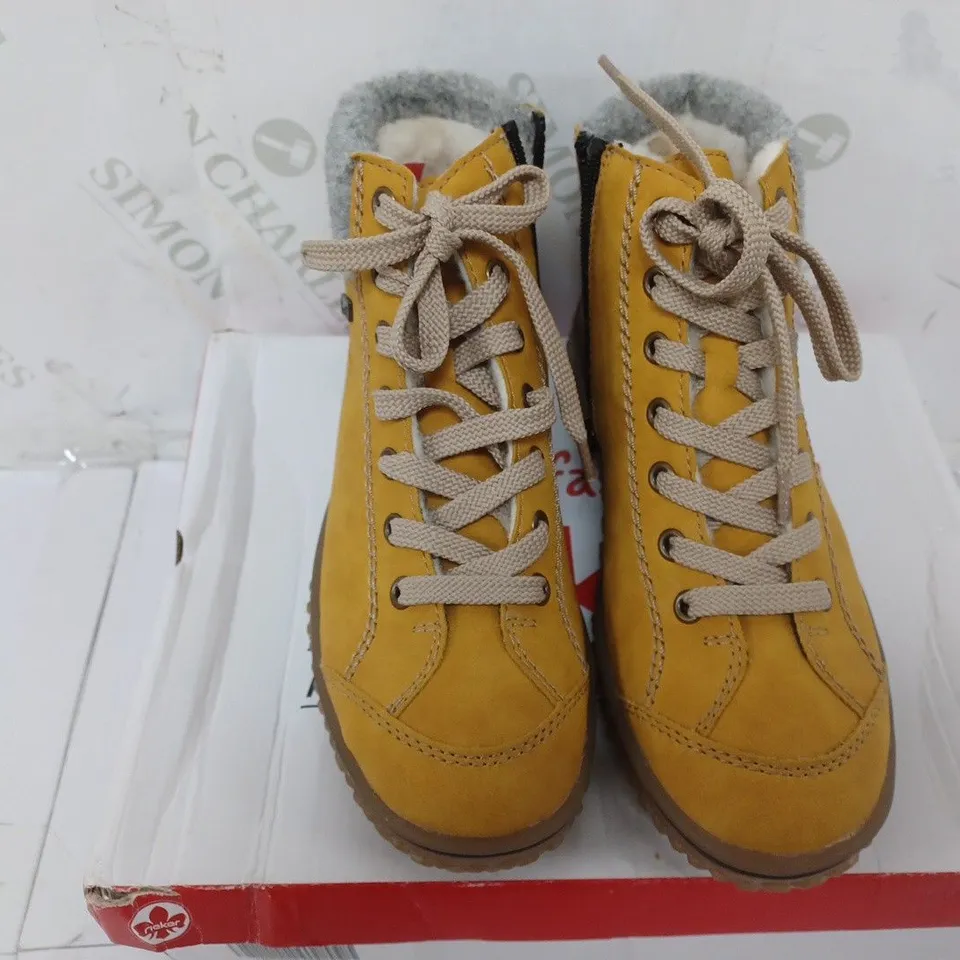 BOXED PAIR OF RIEKER LACE UP WATER RESISTANT BOOTS IN YELLOW SIZE 4