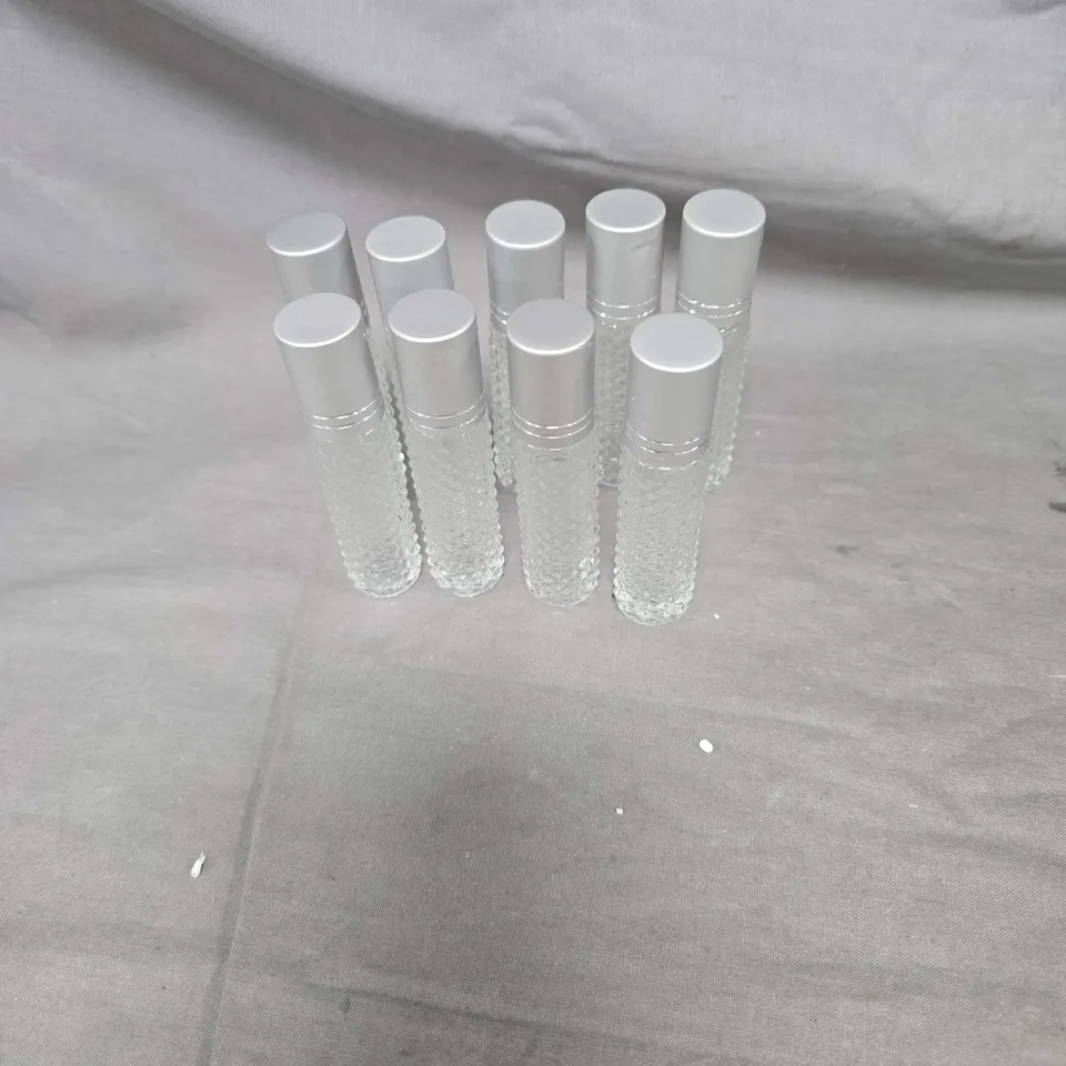 SET OF 9 TEXTURED GLASS BOTTLES WITH SILVER CAPS