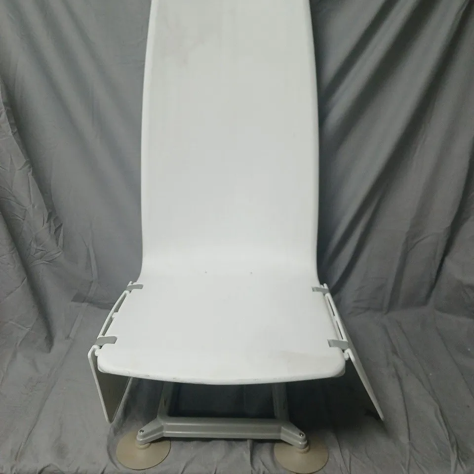 WHITE PLASTIC CHAIR WITH INTEGRATED BACK AND METAL PEDESTAL BASE