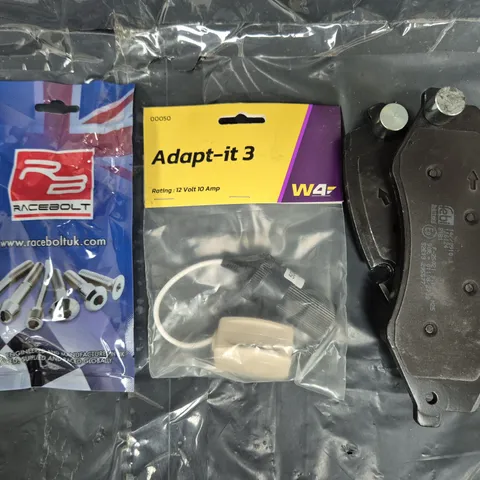 APPROXIMATELY 8 ASSORTED VEHICLE PARTS AND ACCESSORIES TO INCLUDE ADAPT-IT 3 12 VOLT 10 AMP, BRAKE PADS, RACEBOLT, ETC - COLLECTION ONLY