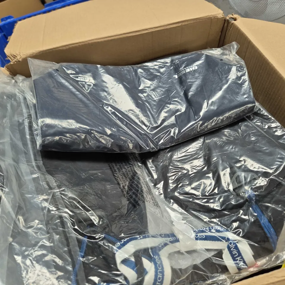 APPROXIMATELY 50 ASSORTED BAGS CLOTHING ITEMS IN VARIOUS SIZES, STYLES & COLOURS TO INCLUDE BRANDS SUCH AS CALVIN KLEIN DIESEL, ETC - COLLECTION ONL